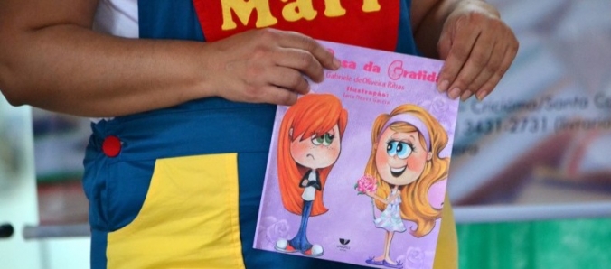 Fa�a a alegria de uma crian�a: Doe um livro ao projeto Biblioteca Solid�ria